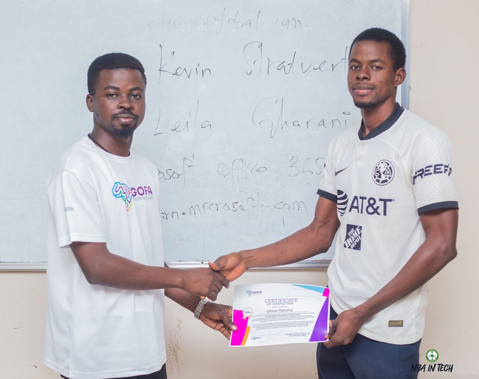 A participant receiving a certificate from a GOFA team member.